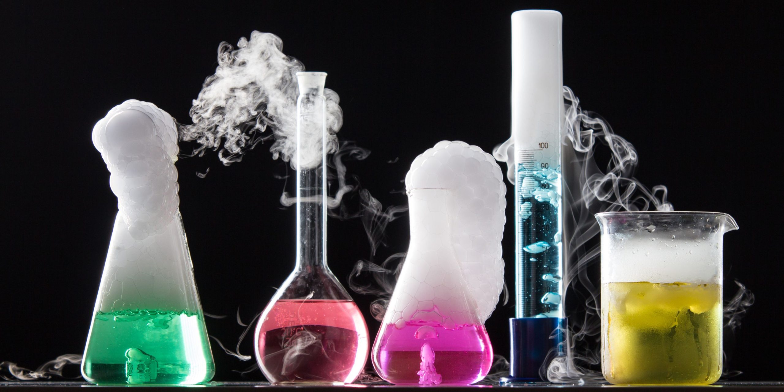 Colourful chemistry equipment on a black background